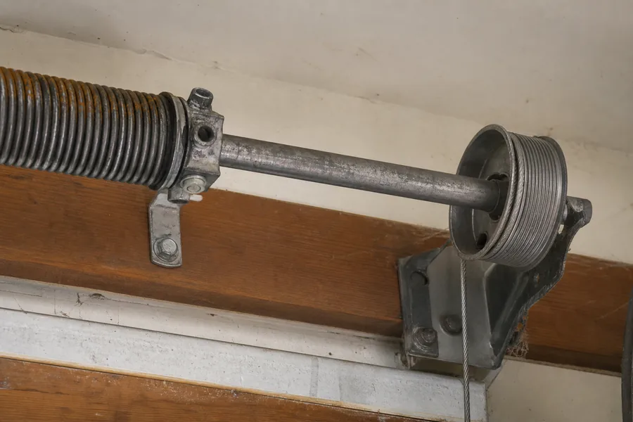 Torsion spring, shaft and cable drum above a garage door in Amarillo, TX