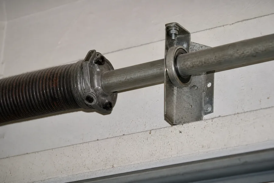 Torsion spring, winding cone and center bearing above a garage door in Amarillo, TX